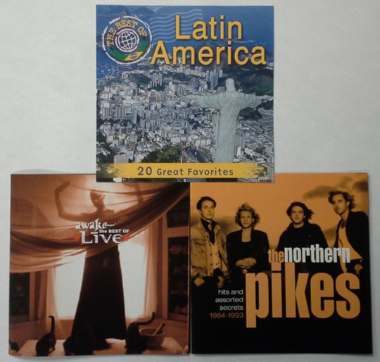 Liner notes or audio CD booklets found in jewel cases for the bands Live and The Northern Pikes. Also shown is the jewel case insert for a CD on Latin American music.