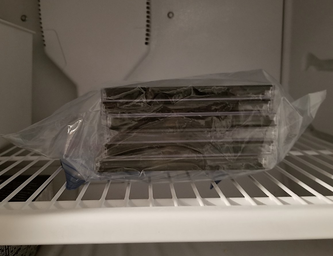 CDs stored in the freezer of an upright refrigerator. For the cold storage of CDs and DVDs, the discs should be placed in Ziplock bags to protect against condensation.