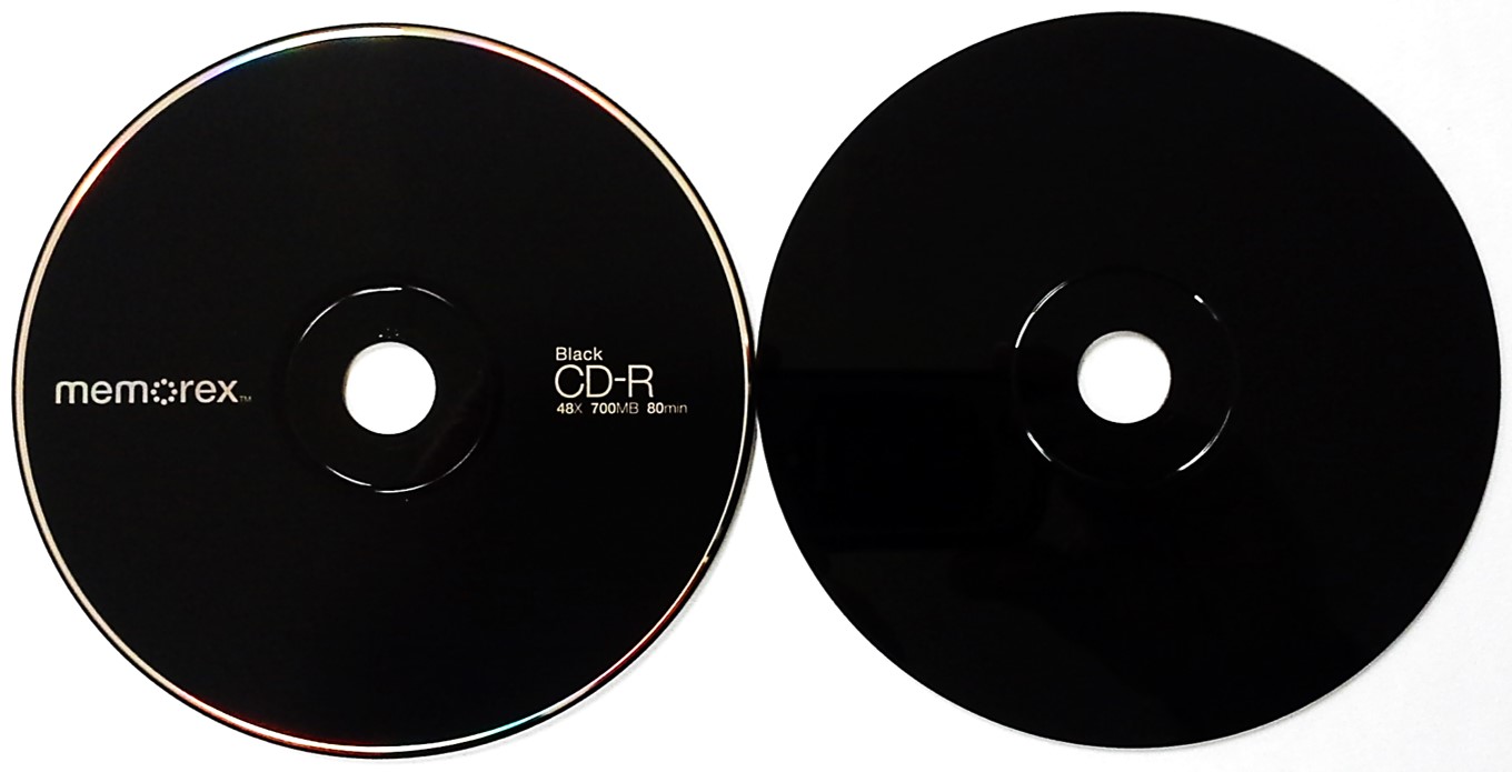 A black CD-R from Memorex. This disc is often light green in color because it would use the phthalocyanine dye and silver alloy metal. A pigment, added to the base, alters the appearance of the disc.