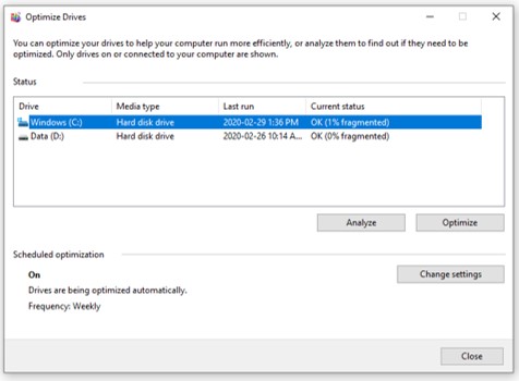 A screen capture of the Optimize Drive window where a hard disk is selected, analyzed, and defragmenting hard drive occurs.