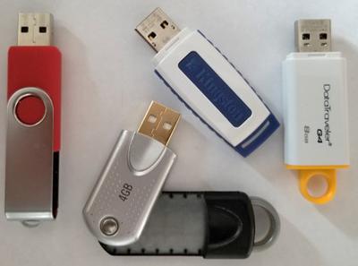 A variety of USB flash drives that can be used to store digital photographs.