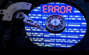 A hard disk crash leads to errors and can be caused by moving the computer while in use or contamination of the hard drive unit or the mechanical failure of parts.