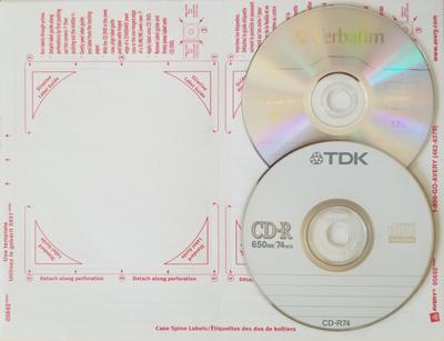 A CD-R and a DVD-R and an adhesive label used for identifying the contents of the disc.