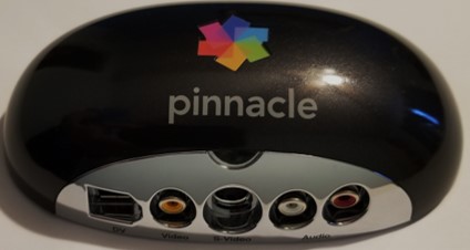 An external analog to digital converter by Pinnacle for digitizing VHS video to a digital file format.