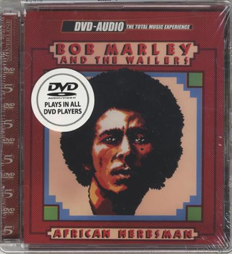 Clamshell storage case for a DVD-Audio disc entitled African Herbsman from Bob Marley and the Whalers. Note a specific reference is made that this disc is compatible or plays in all DVD players.