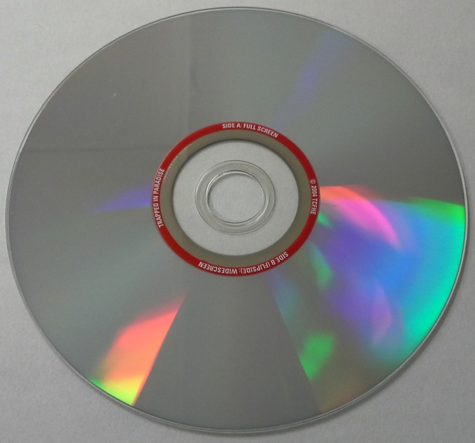 A double-sided and single-layer DVD movie disc. No labeling is possible on either surface of the disc because it would inhibit the reading laser. The label is only possible on the inner hub area.