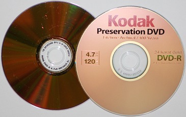 Two gold archival DVD-Rs for the long term storage of digital information. Shown is a Kodak Preservation 4.7 GB DVD and a MAM Archival Gold 4.7 GB DVD.