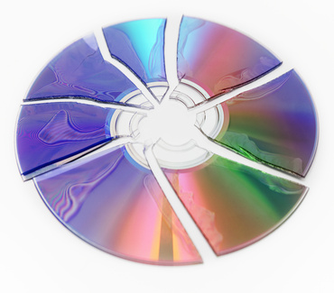 A broken cd or dvd or other optical disc such as a Blu-ray cannot be repaired. Glueing the pieces back together will be unsuccessful.