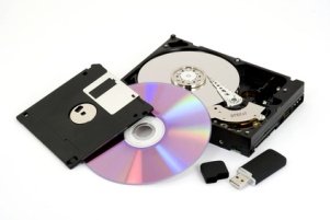 Storage media for storing digital photos and other digital files. Media such as optical discs, hard disk drives, floppy diskettes, and USB flash drive are shown.